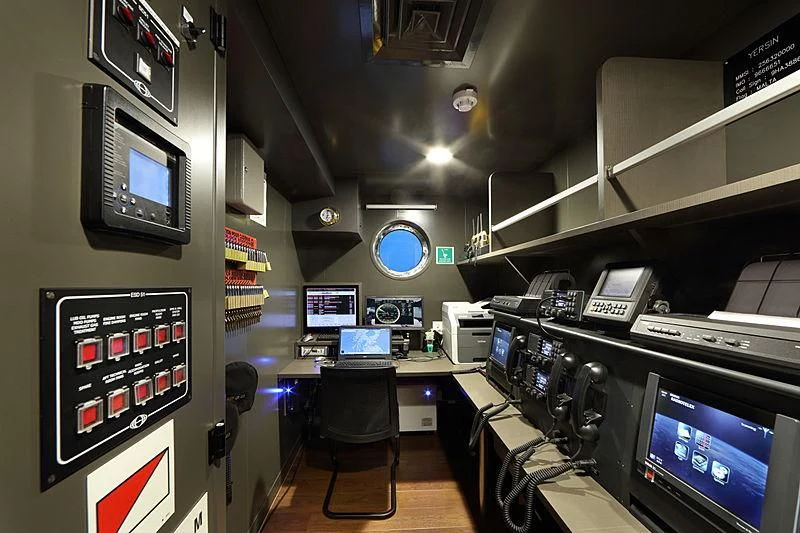 a room with several computers and monitors aboard YERSIN Yacht for Charter