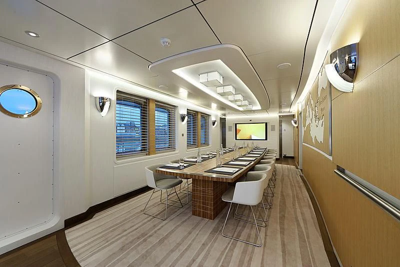 a room with a table and chairs aboard YERSIN Yacht for Charter