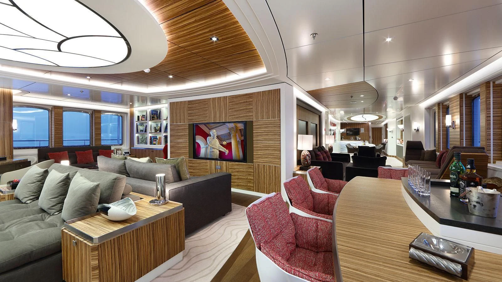 a living room with a large screen aboard YERSIN Yacht for Charter