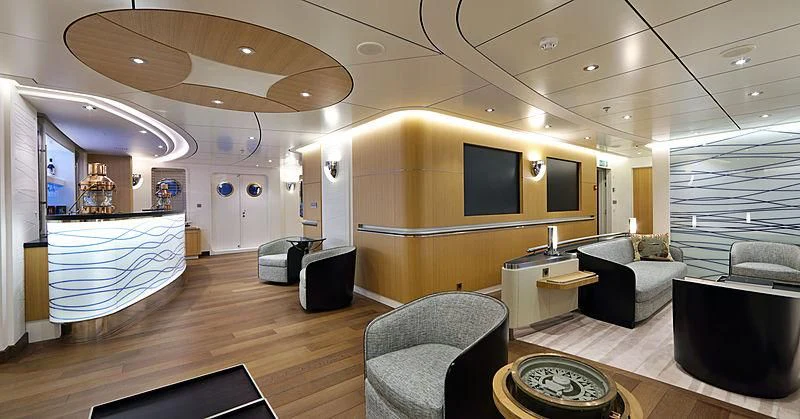 a large living room with a pool table and a large television aboard YERSIN Yacht for Charter