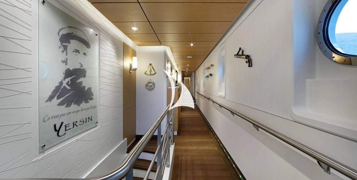 a hallway with a painting on the wall aboard YERSIN Yacht for Charter