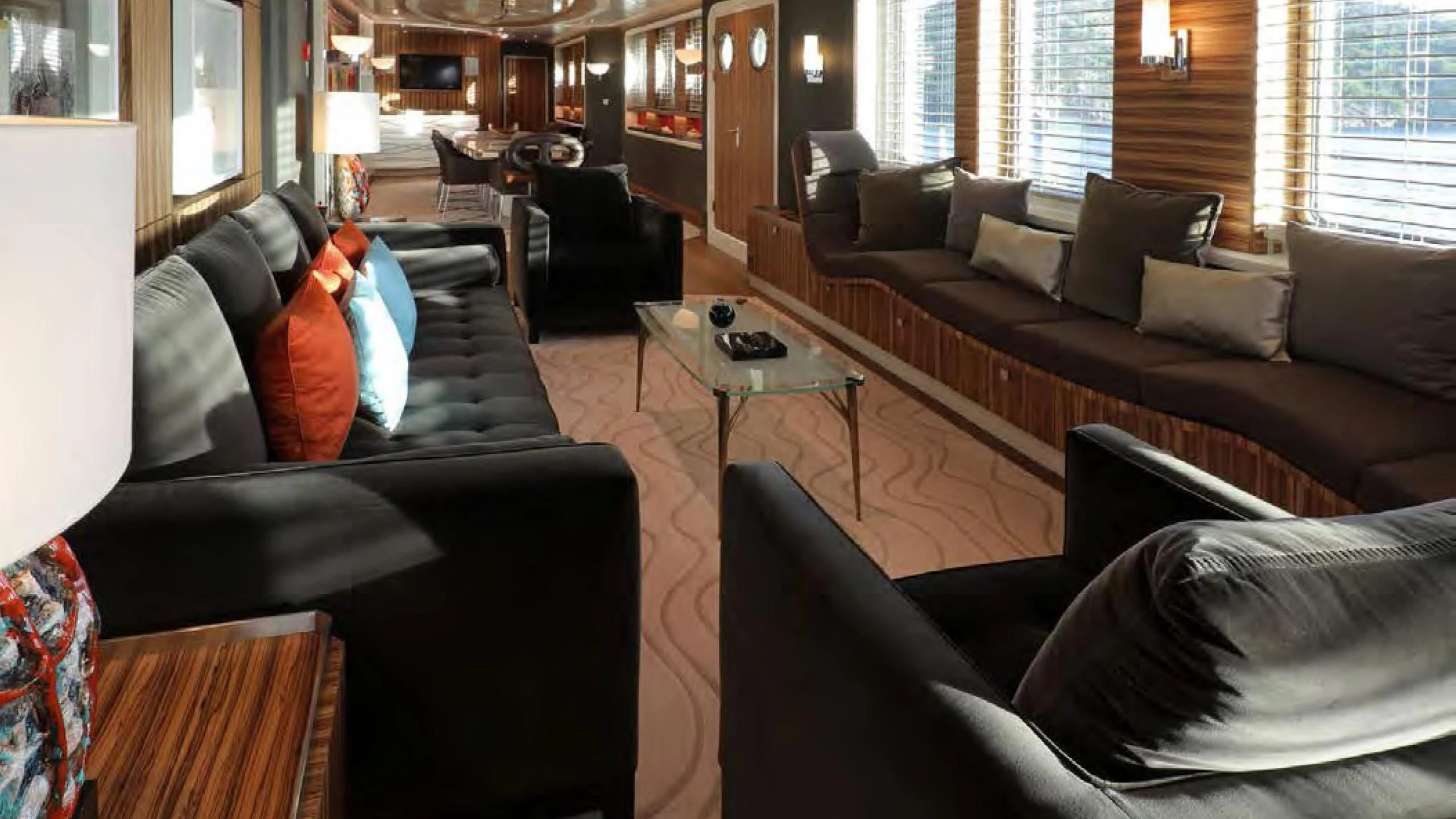 a living room with leather couches and a coffee table aboard YERSIN Yacht for Charter