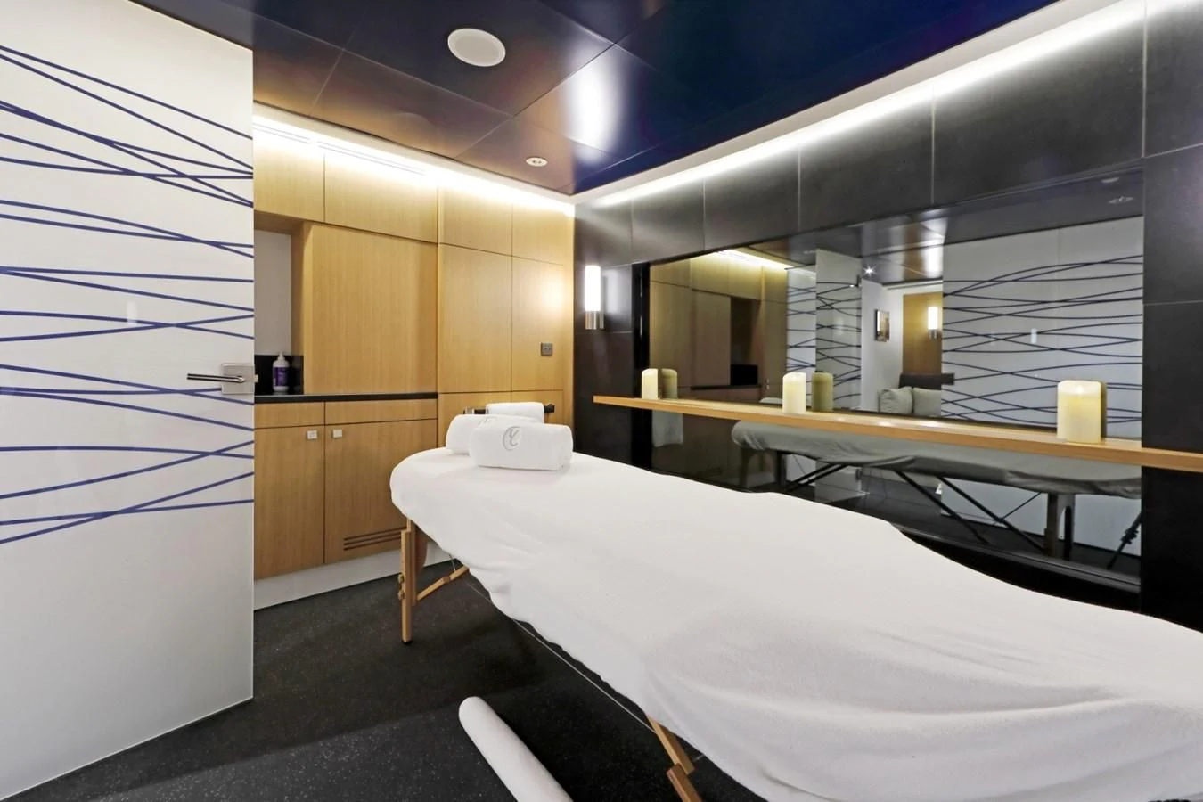 a room with a bed and a desk aboard YERSIN Yacht for Charter