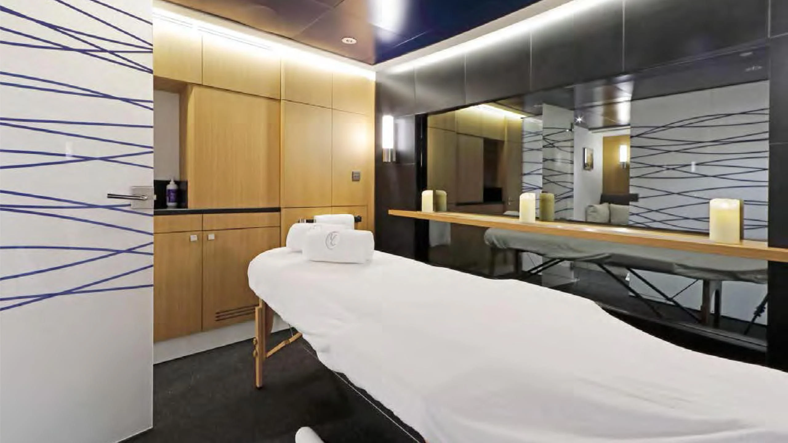 a room with a bed and a desk aboard YERSIN Yacht for Charter