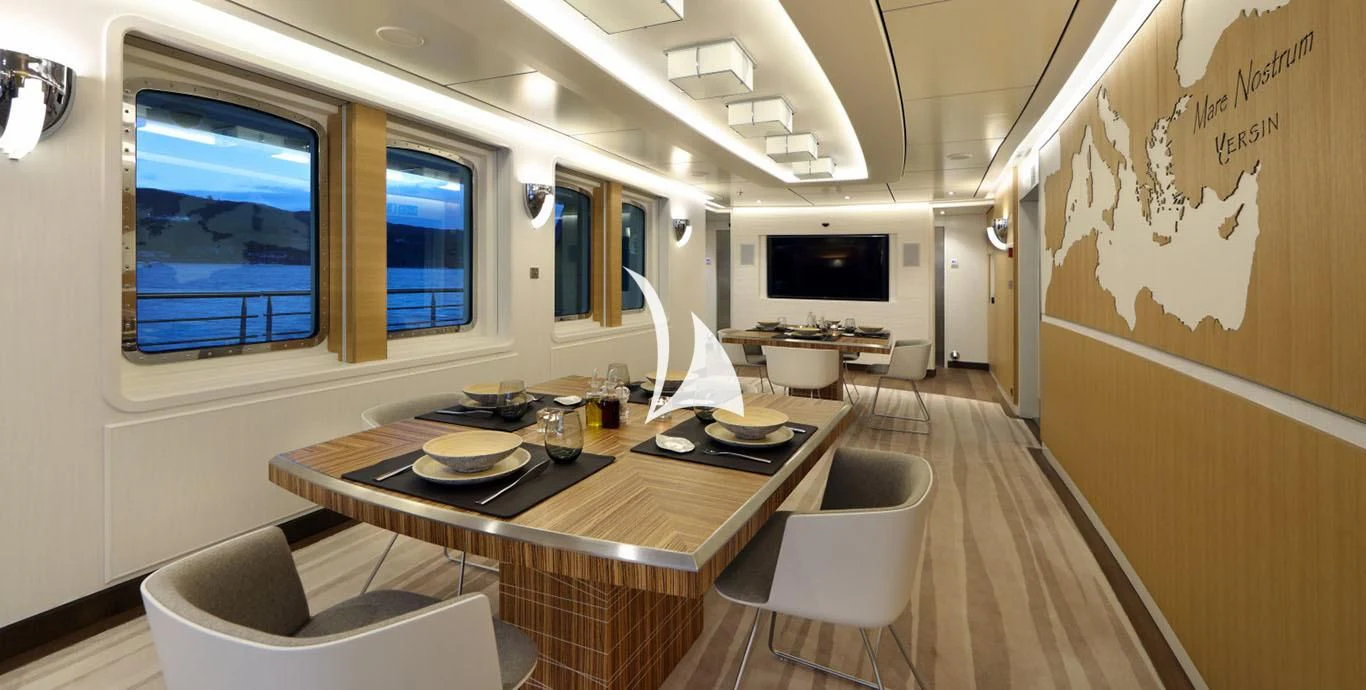 a room with a table and chairs aboard YERSIN Yacht for Charter