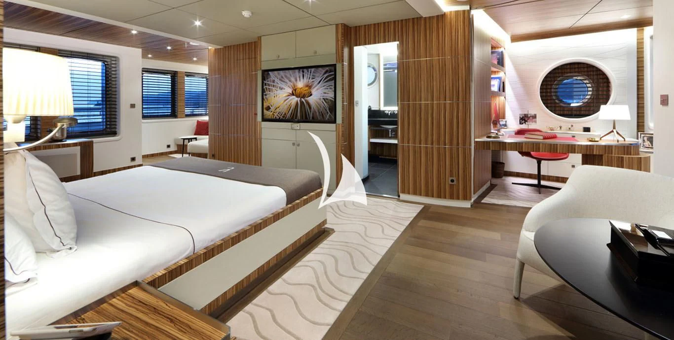a room with a bed and a desk aboard YERSIN Yacht for Charter