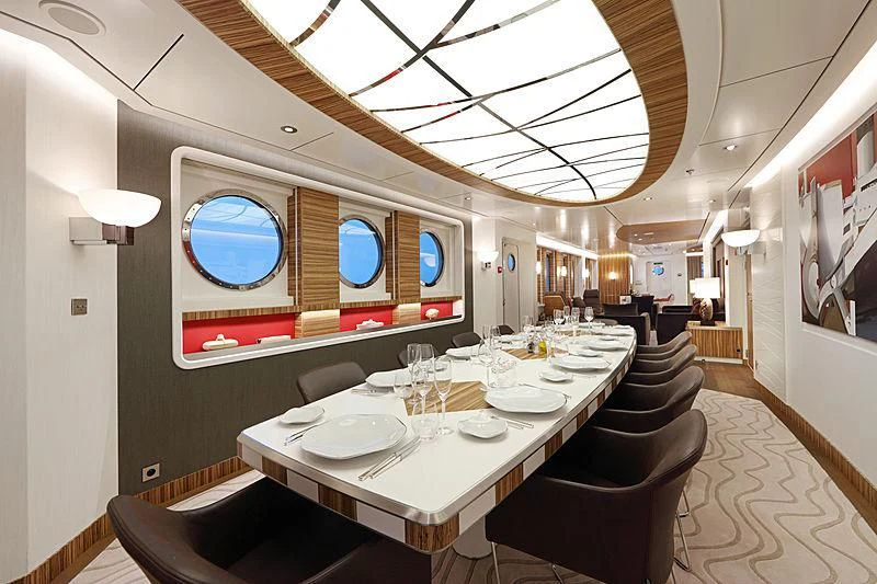a dining room with a table and chairs aboard YERSIN Yacht for Charter