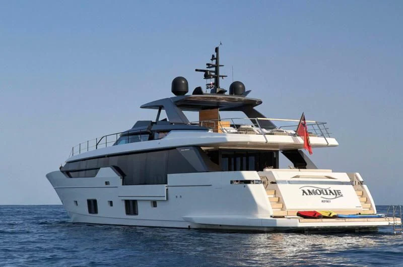 a large white boat in the water aboard AMOUAJE Yacht for Sale