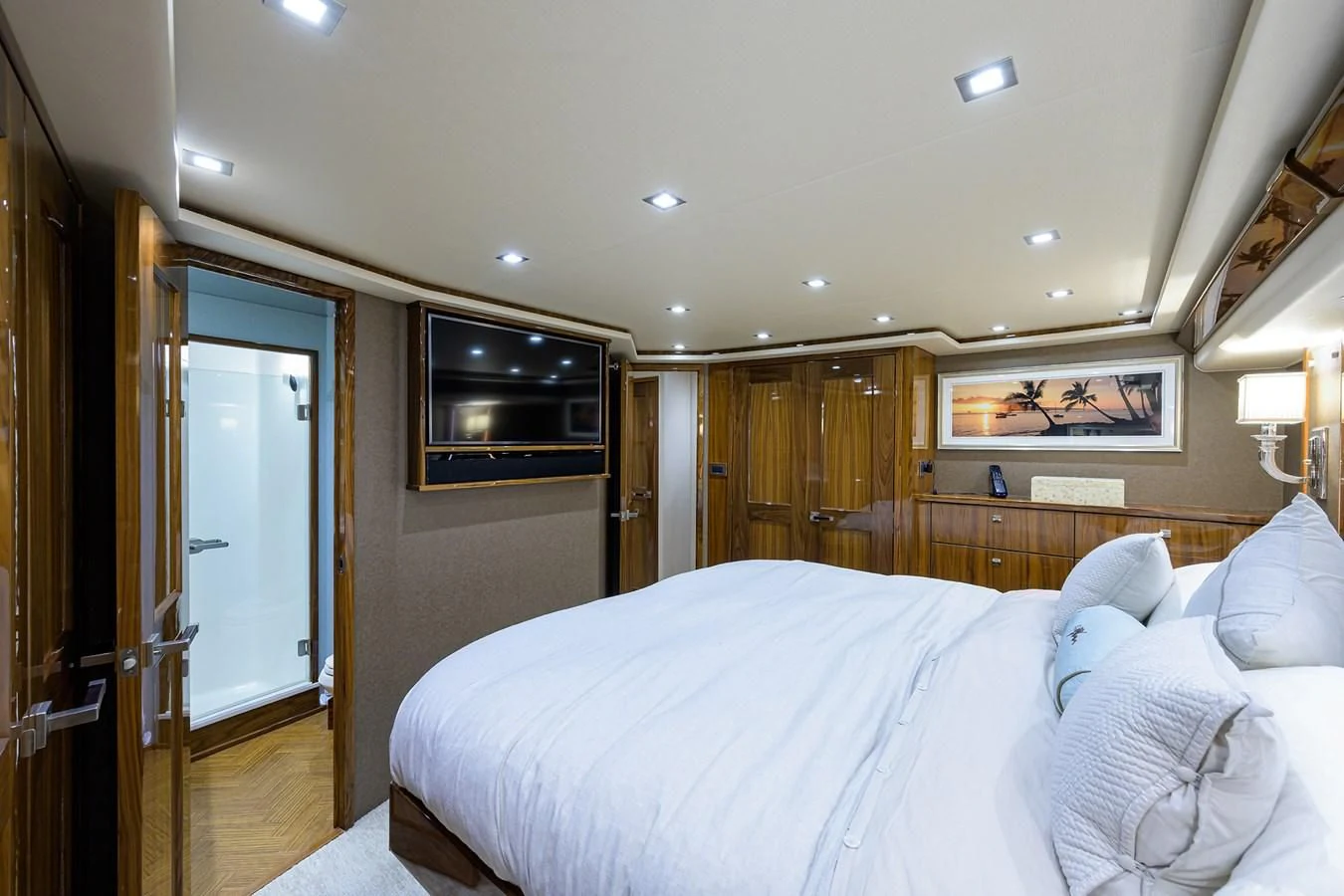 a bedroom with a bed and a television on the wall aboard ABSOLUT Yacht for Sale