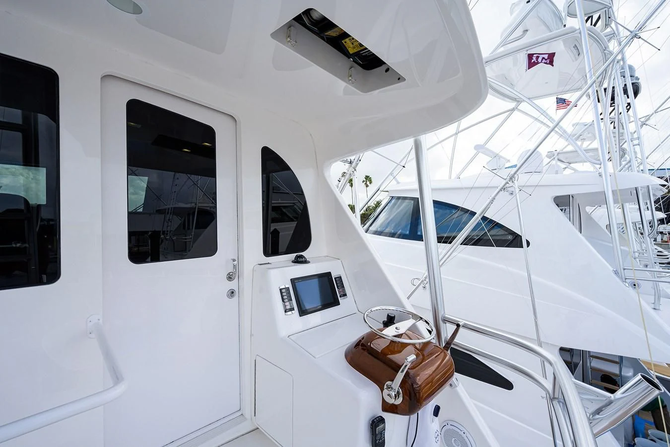 a white boat with a door open aboard ABSOLUT Yacht for Sale