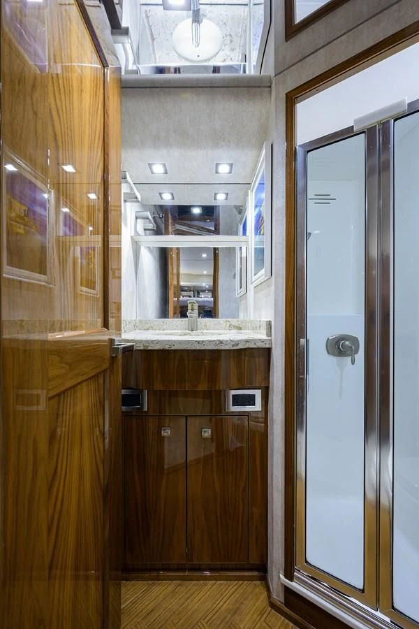 a room with wooden cabinets aboard ABSOLUT Yacht for Sale