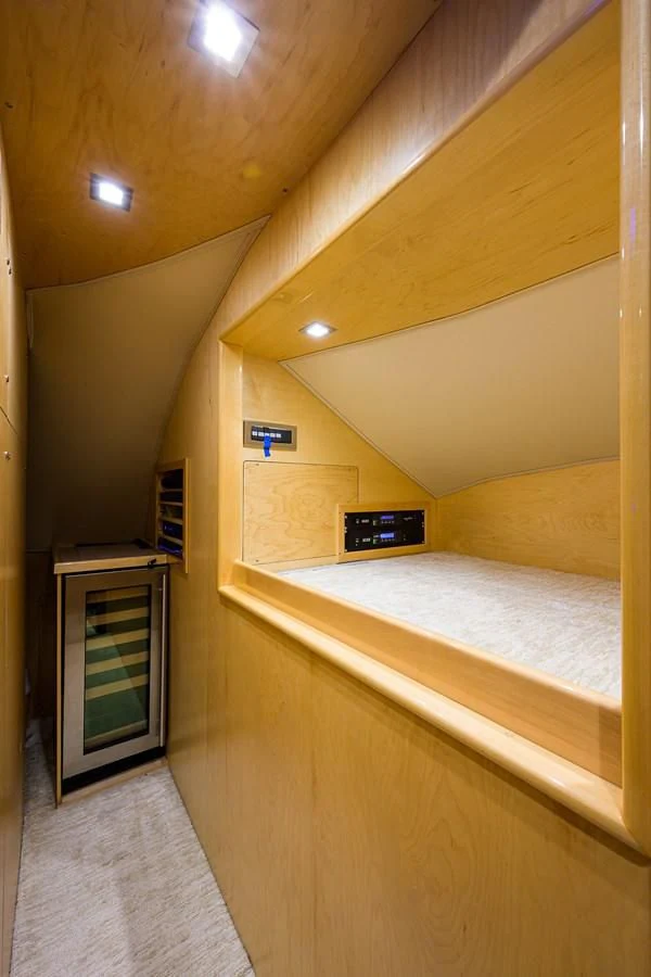 a room with a bed and a television aboard ABSOLUT Yacht for Sale
