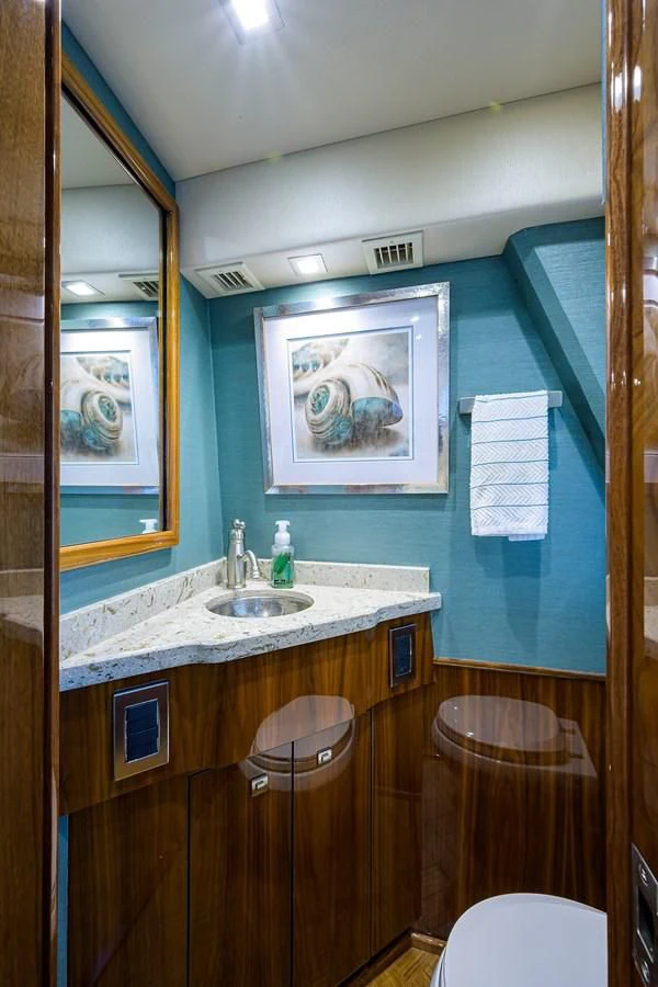 a bathroom with a sink and a mirror aboard ABSOLUT Yacht for Sale