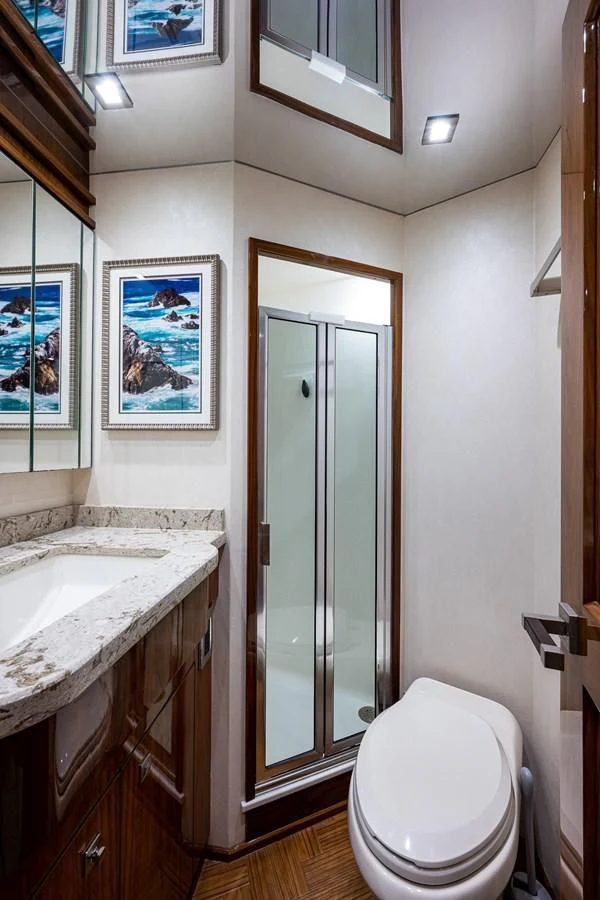 a bathroom with a toilet and sink aboard ABSOLUT Yacht for Sale