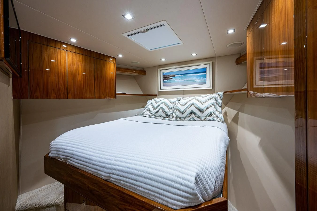 a room with a bed and a television aboard ABSOLUT Yacht for Sale
