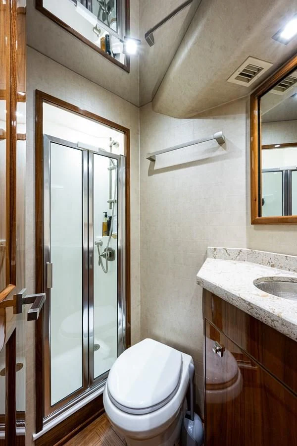 a bathroom with a glass door aboard ABSOLUT Yacht for Sale