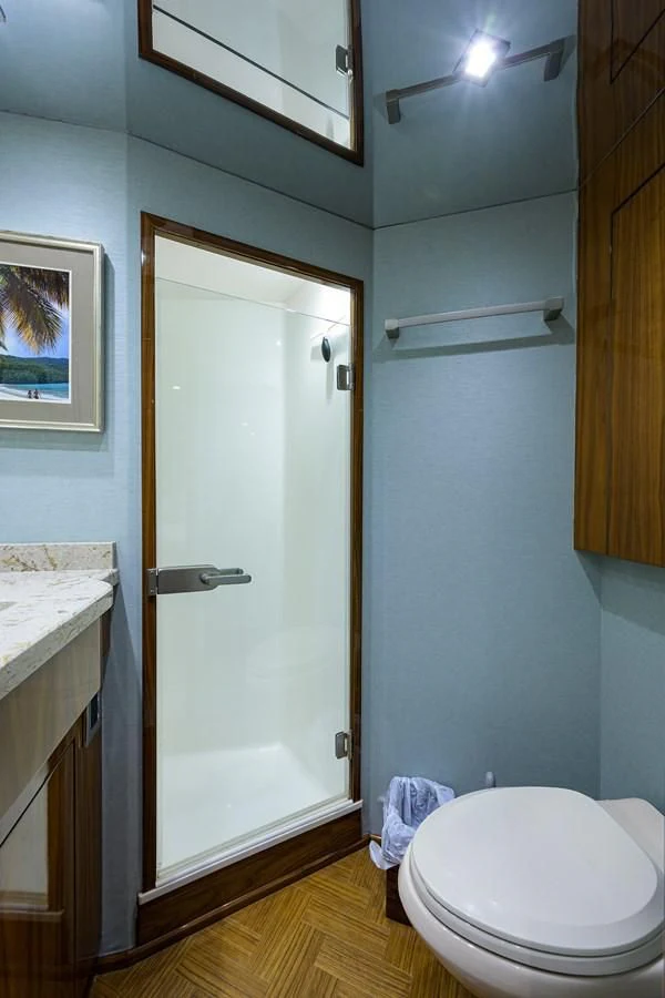 a bathroom with a toilet and a shower aboard ABSOLUT Yacht for Sale