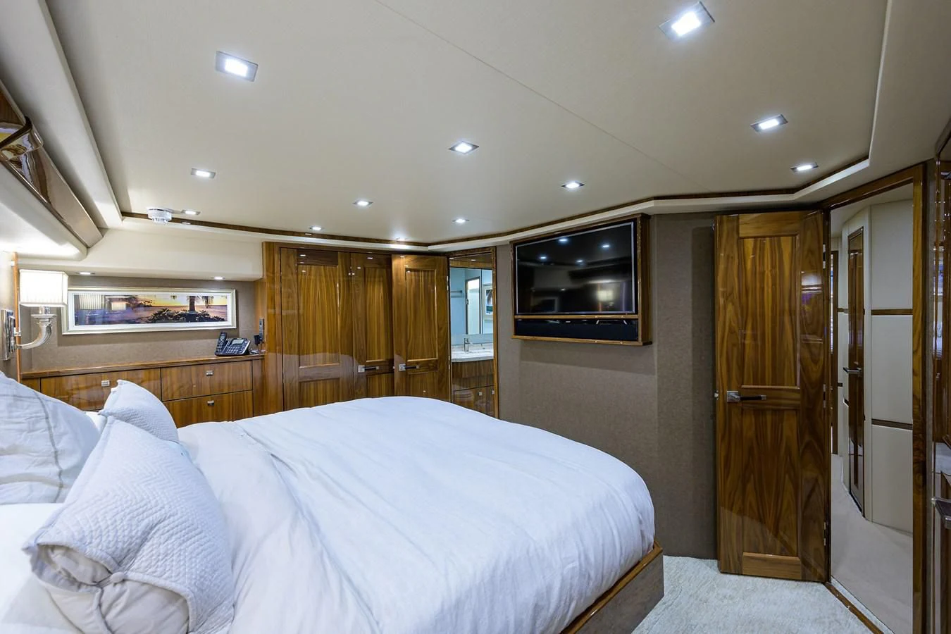 a bedroom with a bed and a closet aboard ABSOLUT Yacht for Sale