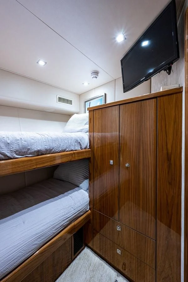 a room with a bed and a television aboard ABSOLUT Yacht for Sale