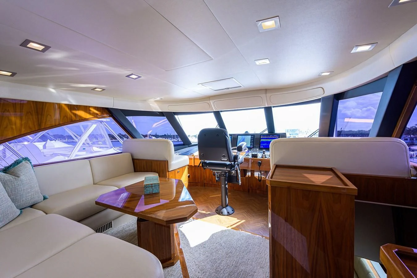 a room with a couch and a table and a tv aboard ABSOLUT Yacht for Sale