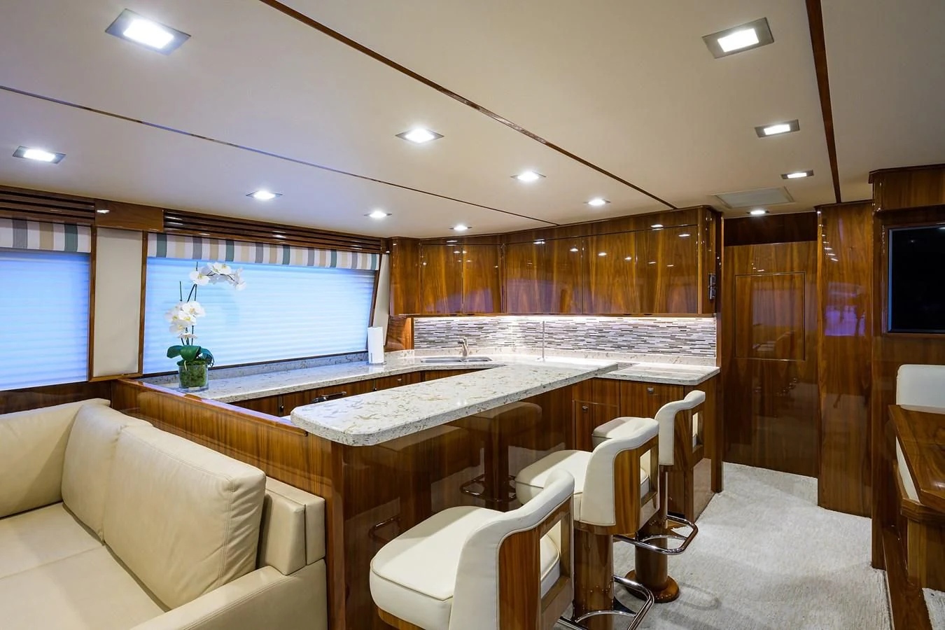 a large room with a table and chairs aboard ABSOLUT Yacht for Sale