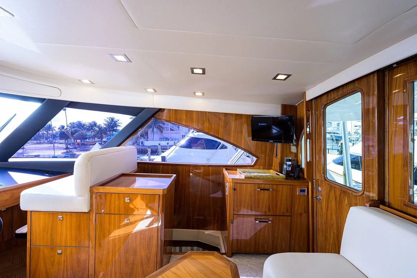 a room with a large window and a desk with a tv on it aboard ABSOLUT Yacht for Sale