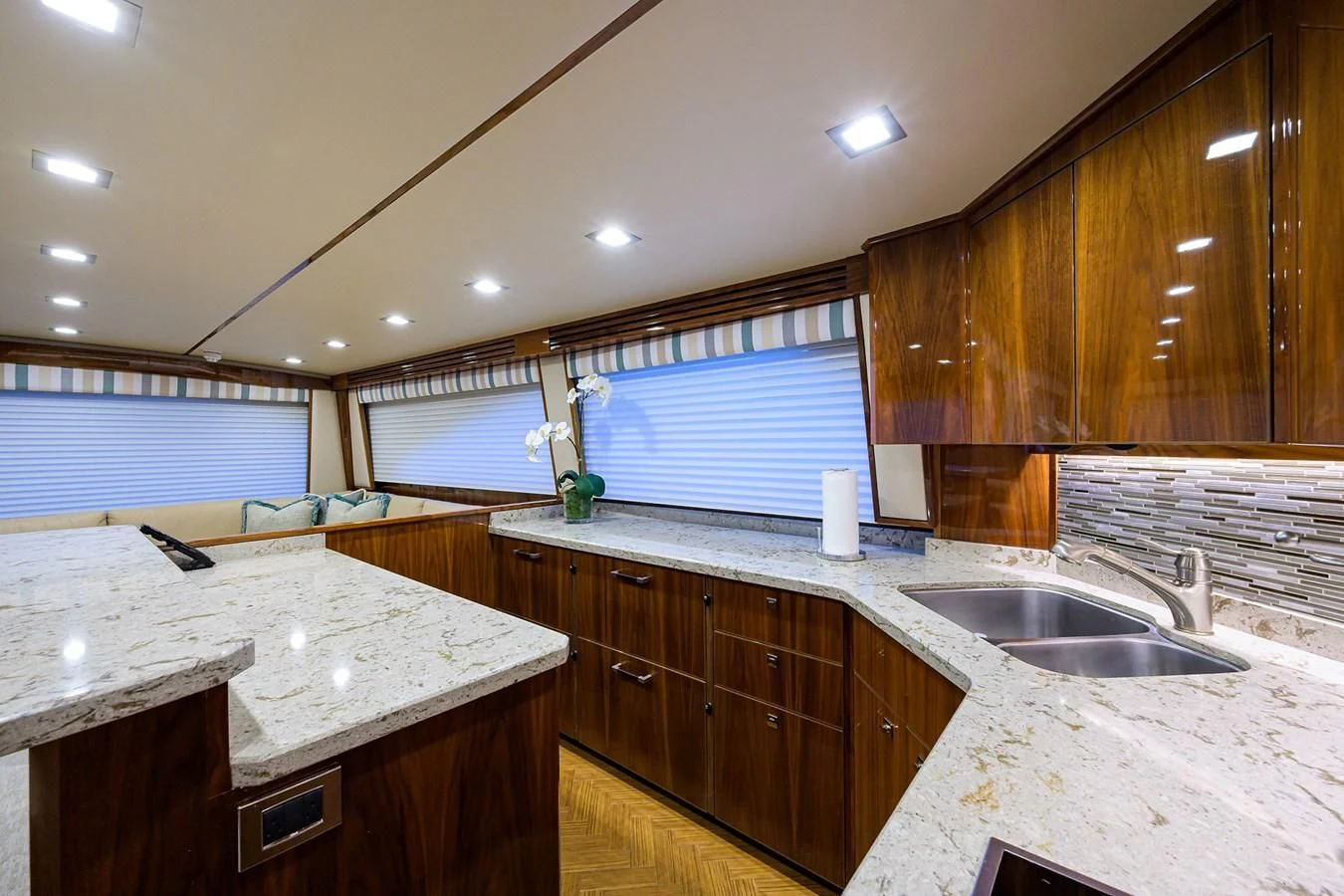 a kitchen with wooden cabinets aboard ABSOLUT Yacht for Sale