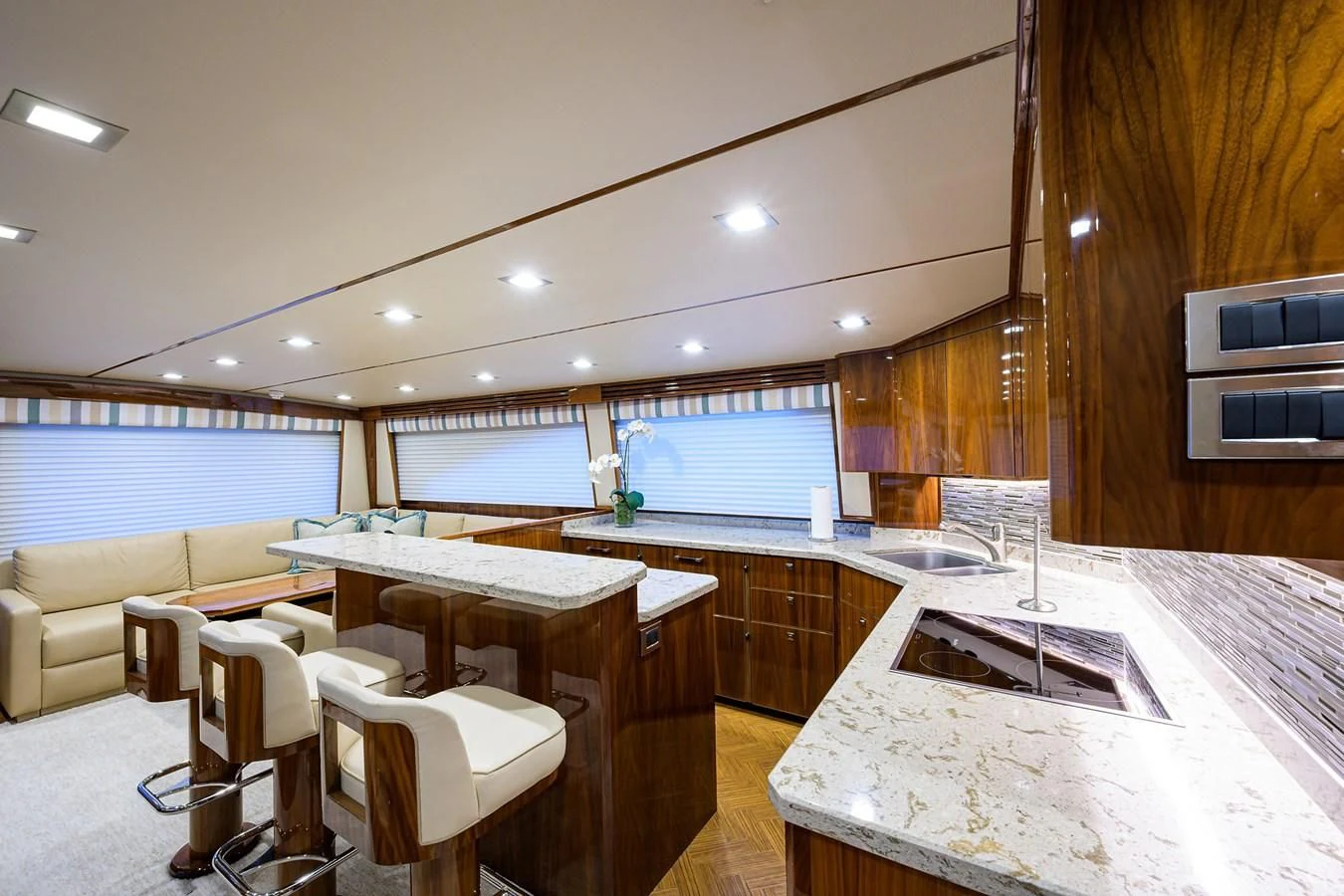 a large kitchen with a table and chairs aboard ABSOLUT Yacht for Sale