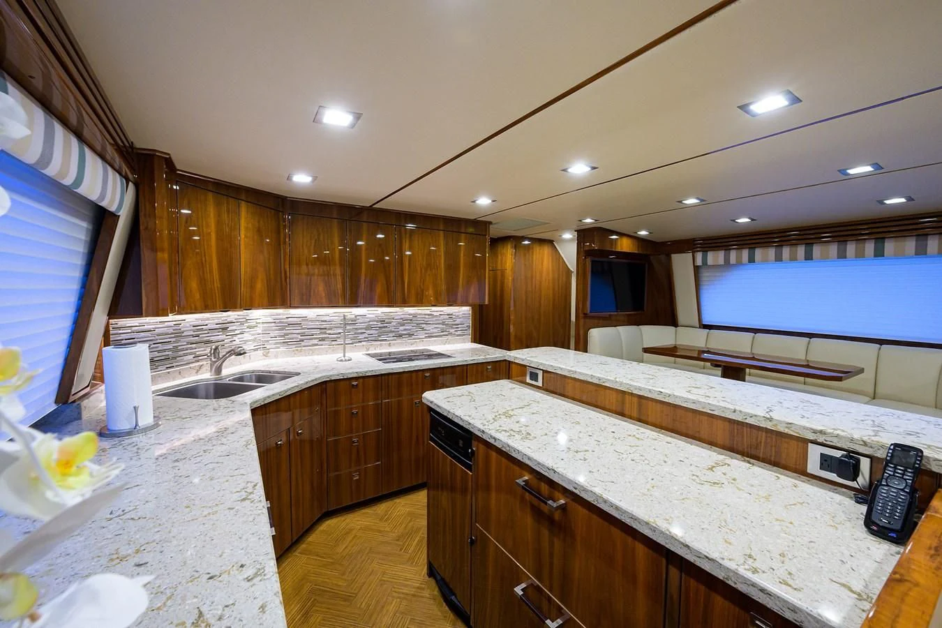 a large kitchen with wooden cabinets aboard ABSOLUT Yacht for Sale