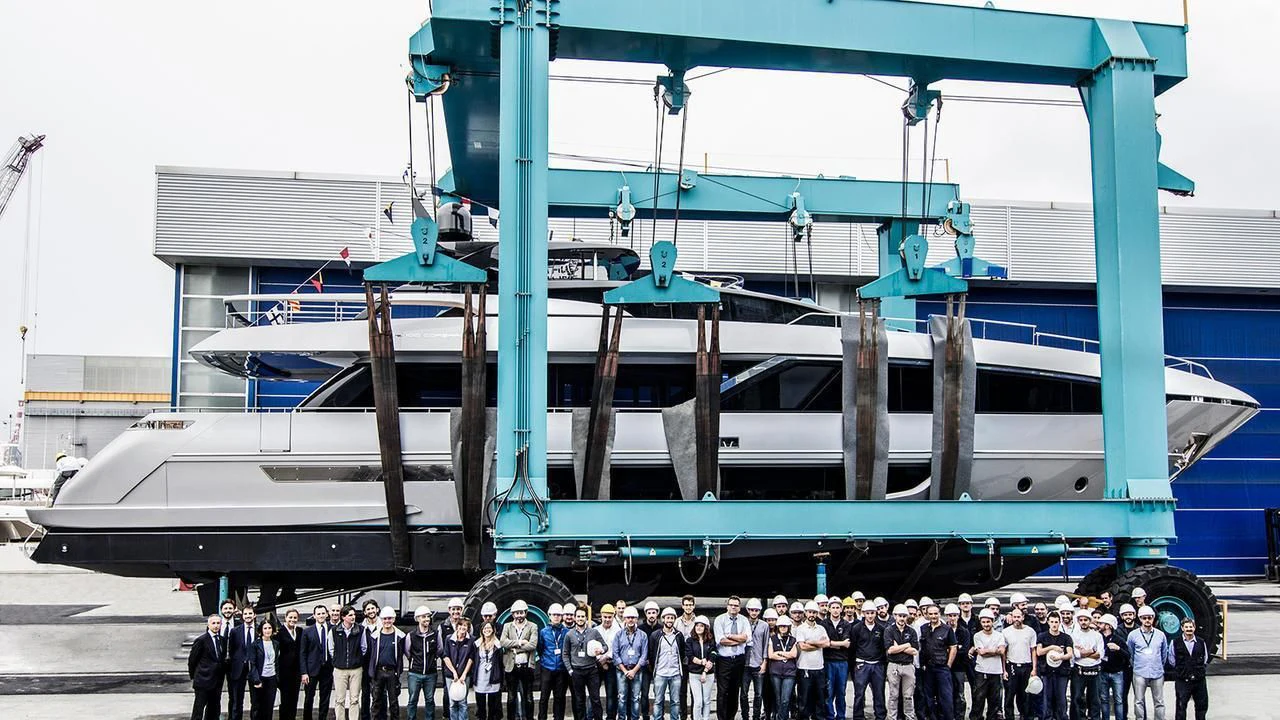 a group of people standing in front of a boat aboard BERNADETTE Yacht for Sale