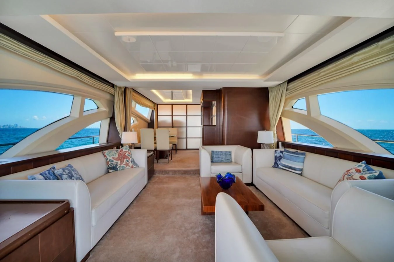 a living room with a large window aboard TABATA Yacht for Sale