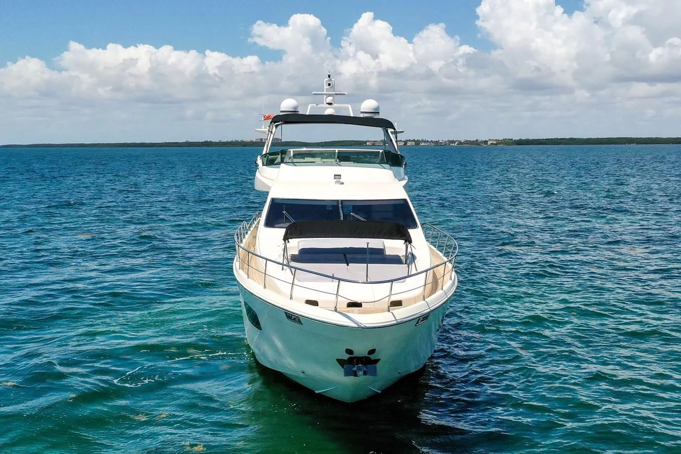 a white boat in the water aboard TABATA Yacht for Sale