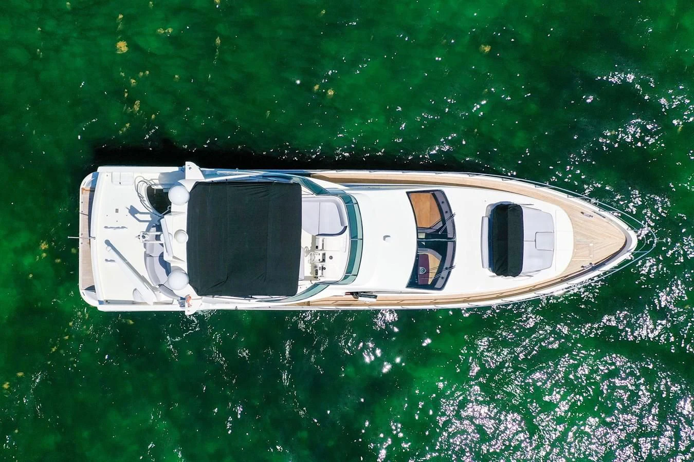 a white boat in the water aboard TABATA Yacht for Sale