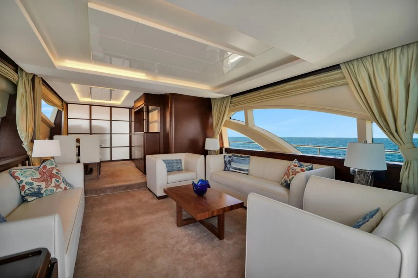 a living room with a large window aboard TABATA Yacht for Sale