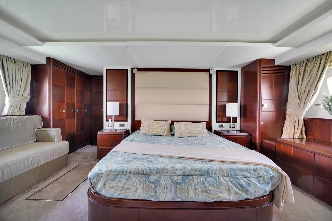 a large bed in a hotel room aboard TABATA Yacht for Sale