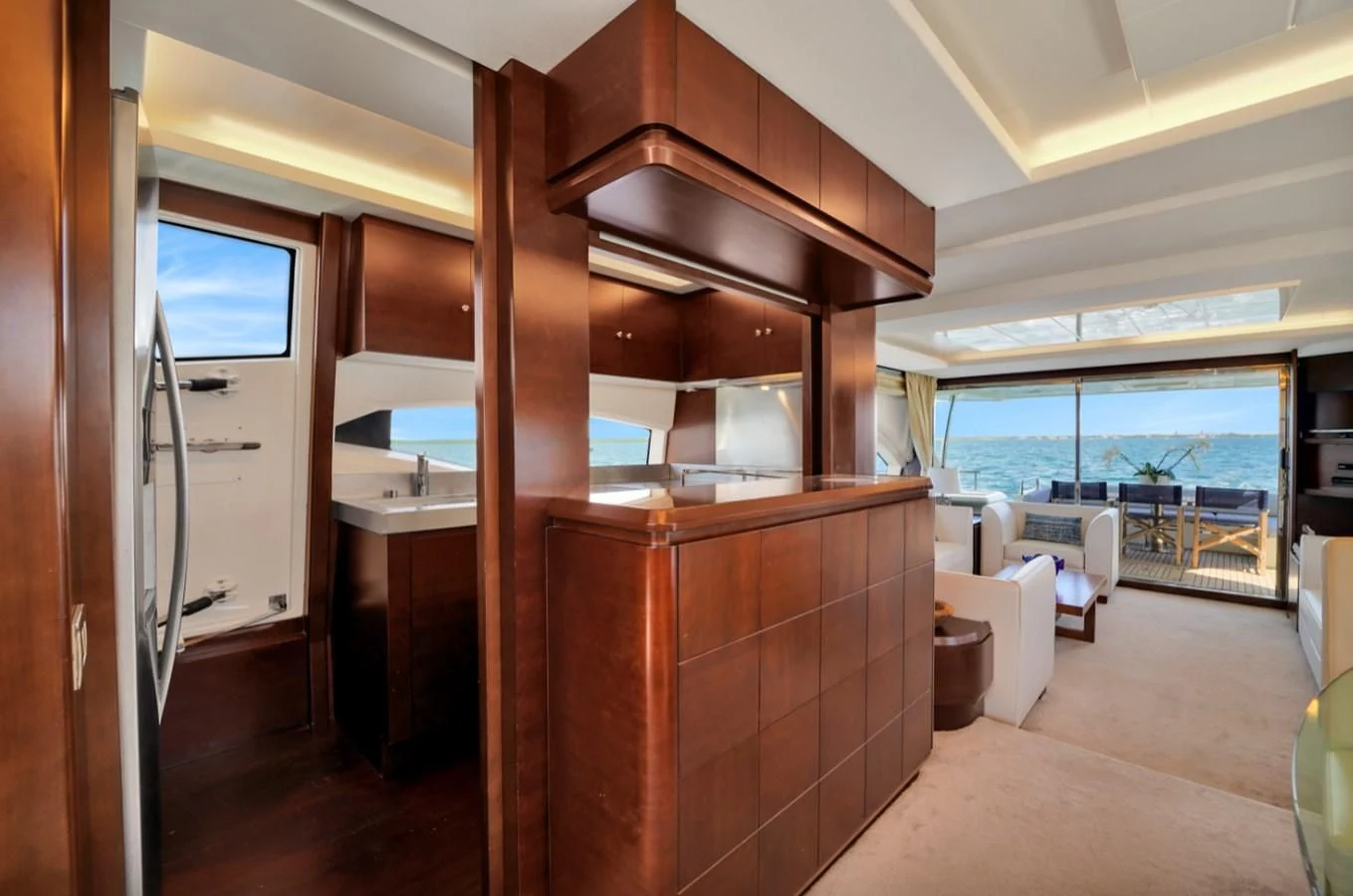 a kitchen with a wood cabinet aboard TABATA Yacht for Sale