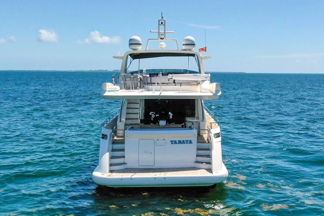 a white boat in the water aboard TABATA Yacht for Sale