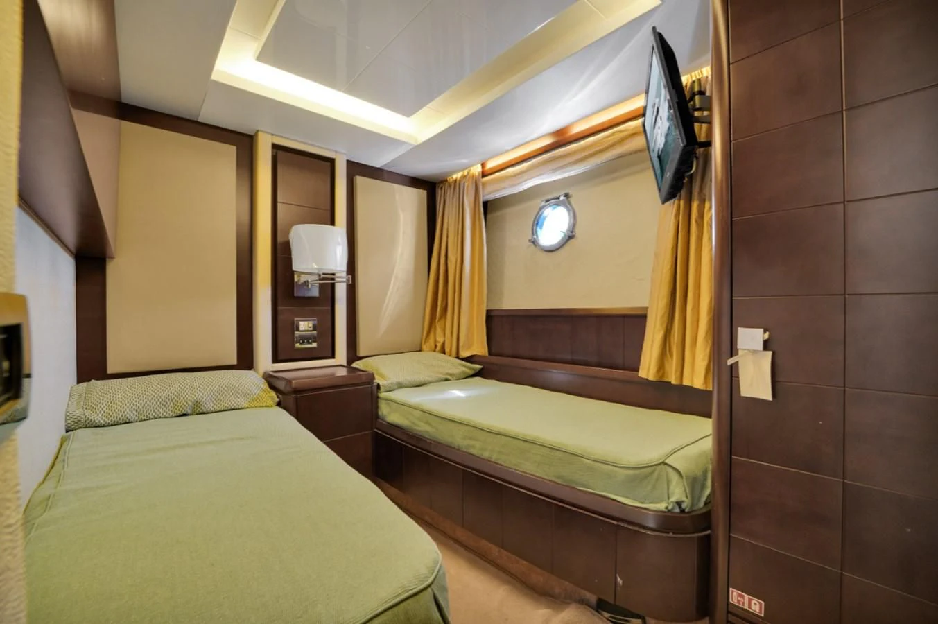 a couple of beds in a hotel room aboard TABATA Yacht for Sale