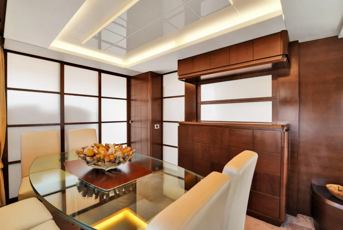 a room with a table and chairs aboard TABATA Yacht for Sale