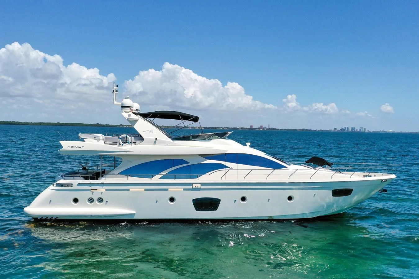 a white yacht in the water aboard TABATA Yacht for Sale