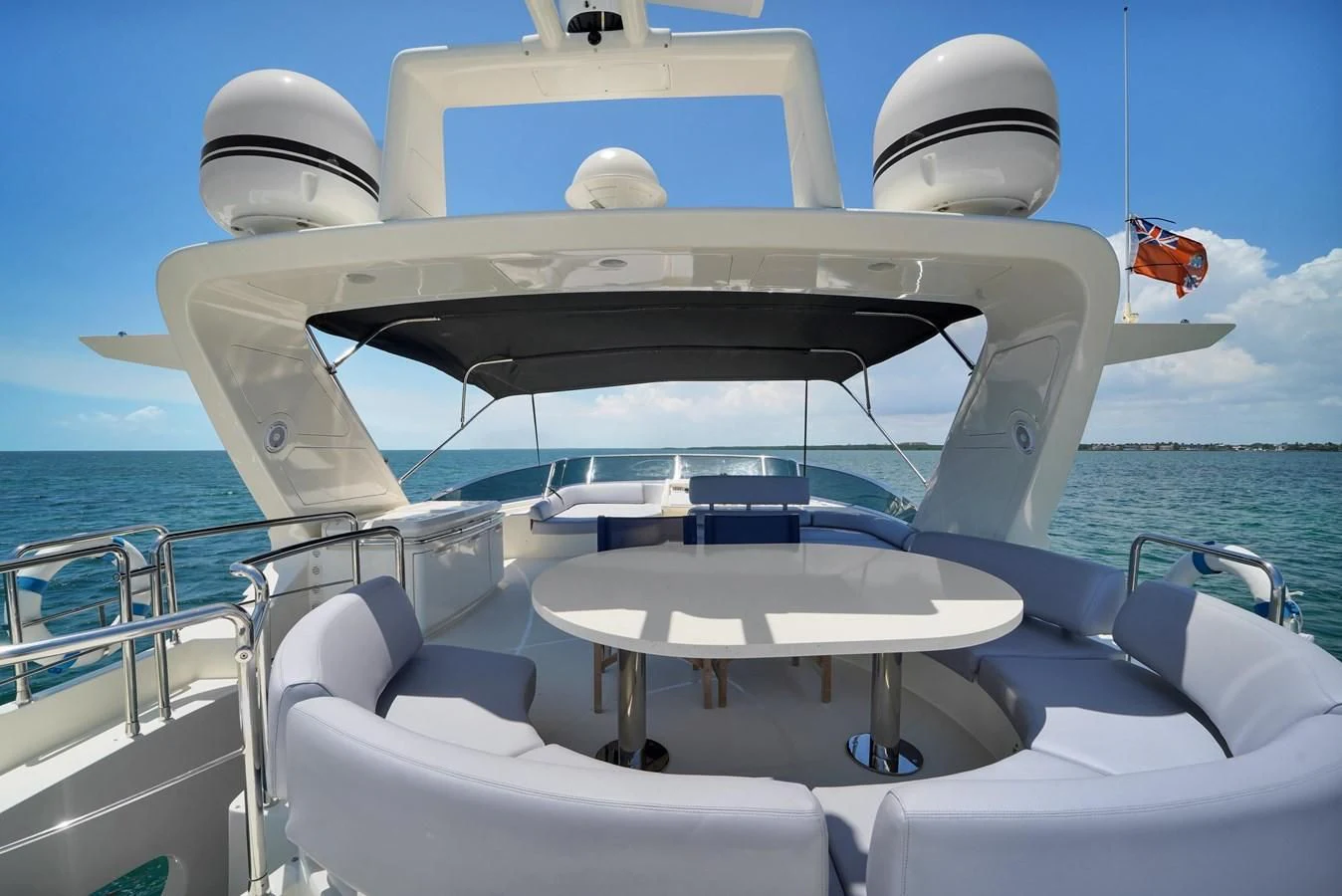 a boat with a table and chairs on it aboard TABATA Yacht for Sale
