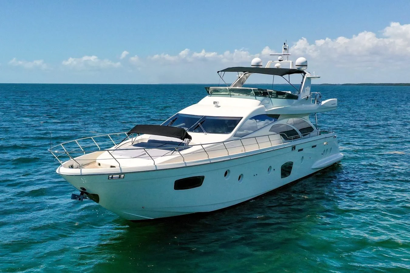 a white yacht in the water aboard TABATA Yacht for Sale