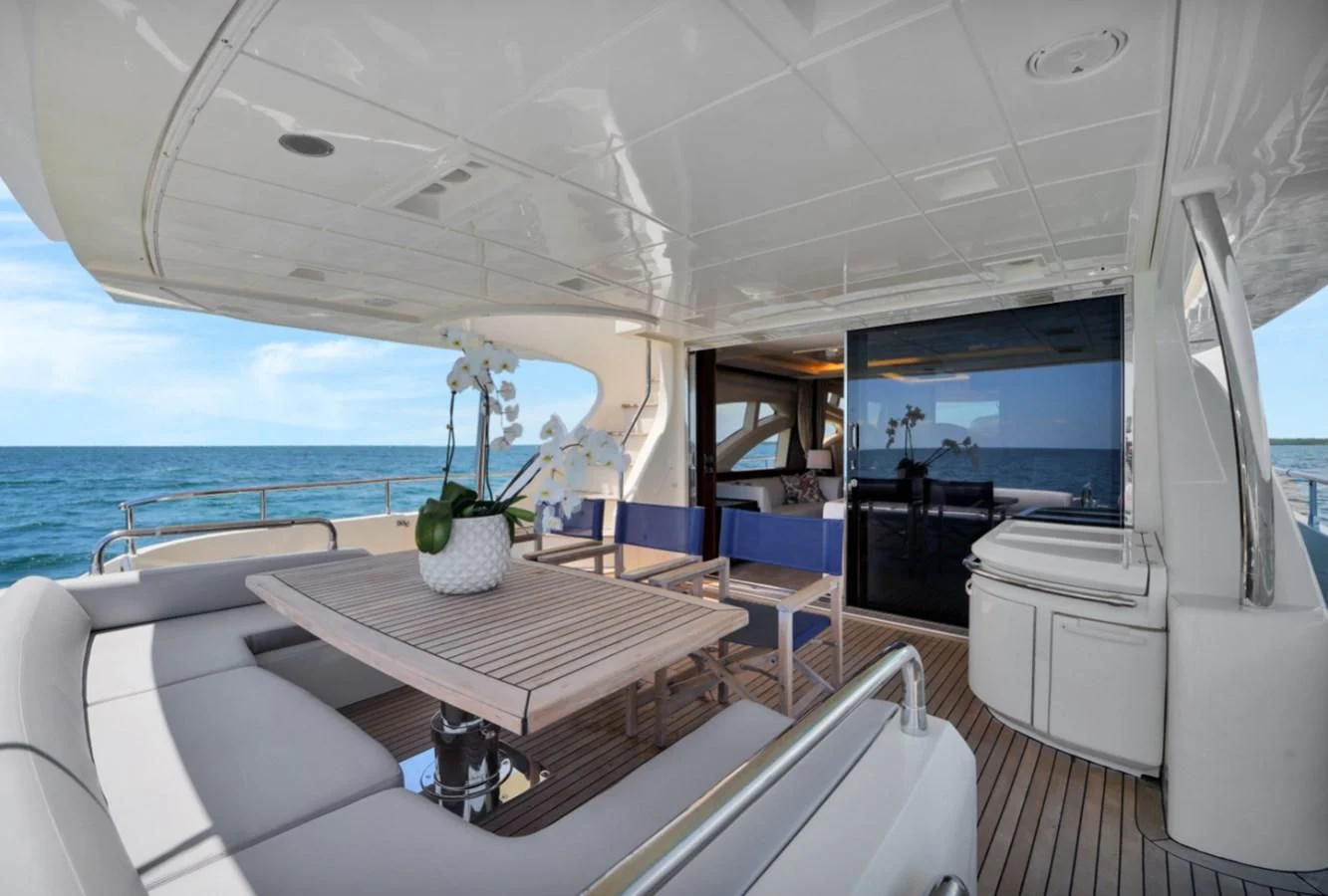 a boat with a table and chairs aboard TABATA Yacht for Sale