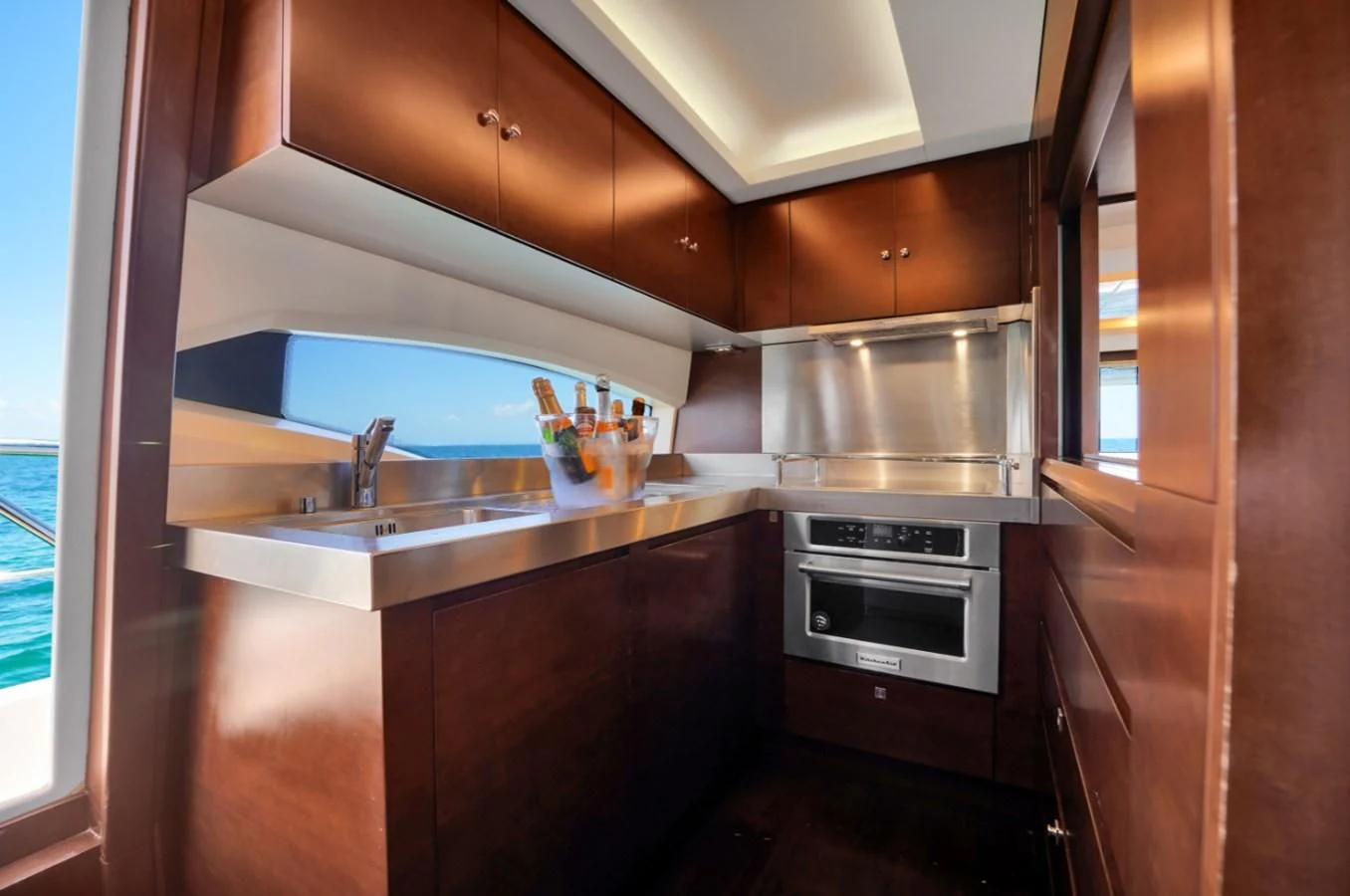 a kitchen with a stainless steel oven aboard TABATA Yacht for Sale