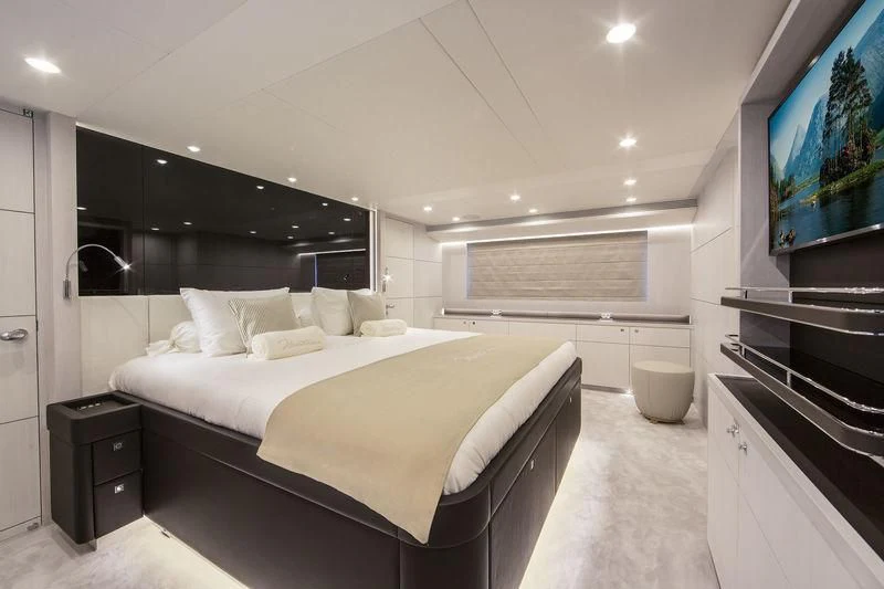 a large bedroom with a large bed aboard NICOSTASIA Yacht for Sale