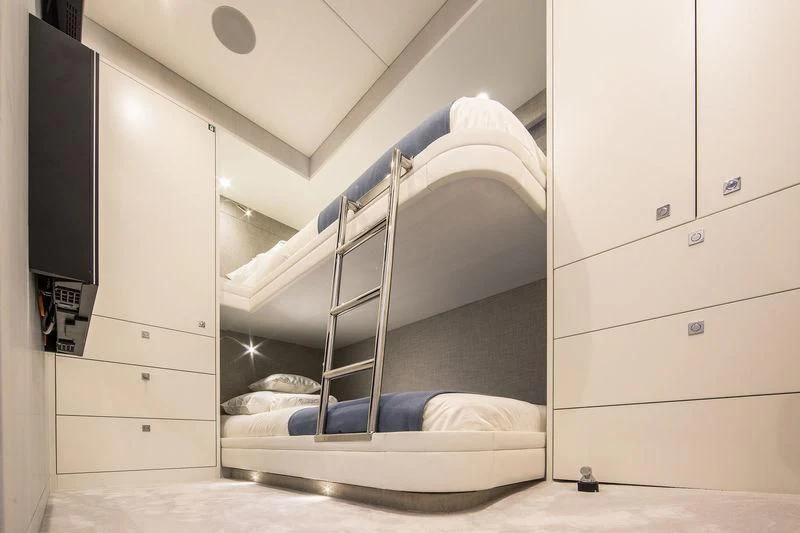 a room with a bed and a ladder aboard NICOSTASIA Yacht for Sale