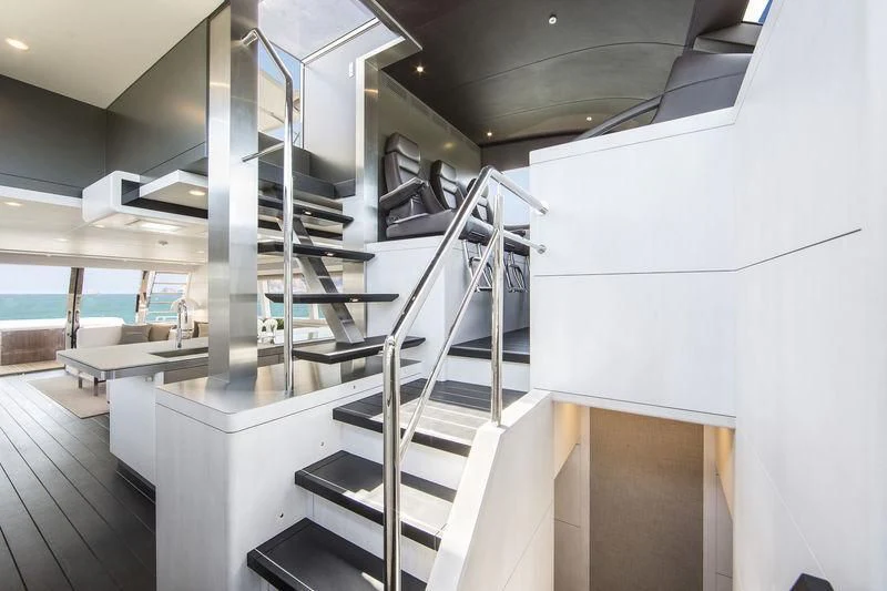 a large room with white walls aboard NICOSTASIA Yacht for Sale