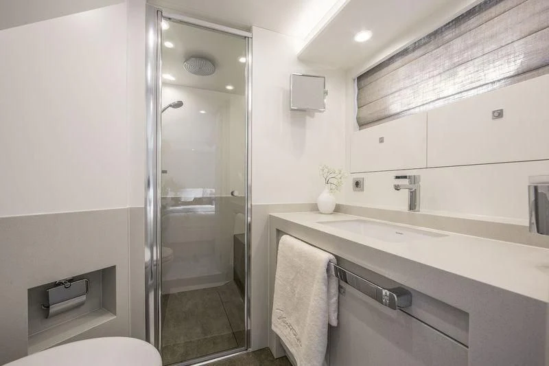 a bathroom with a glass shower aboard NICOSTASIA Yacht for Sale