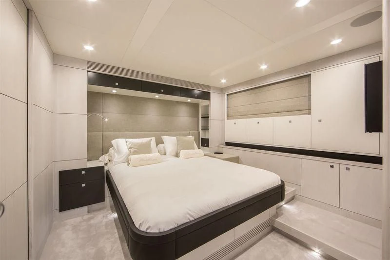 a large white room with a bed aboard NICOSTASIA Yacht for Sale