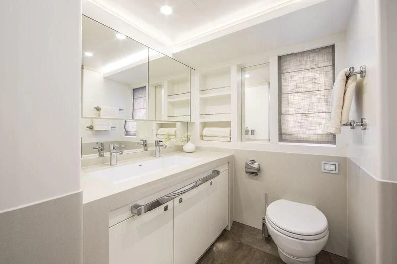 a bathroom with a sink and a toilet aboard NICOSTASIA Yacht for Sale